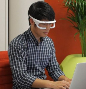 The portable device worn like a pair of sunglasses emits a soft green light onto the eyes.