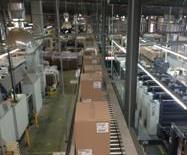Overhead carton conveyors - cost effective and space saving