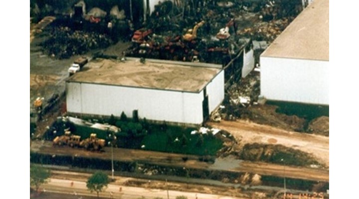 Aftermath of fire showing Thermomass sandwich panels standing amid the debris.