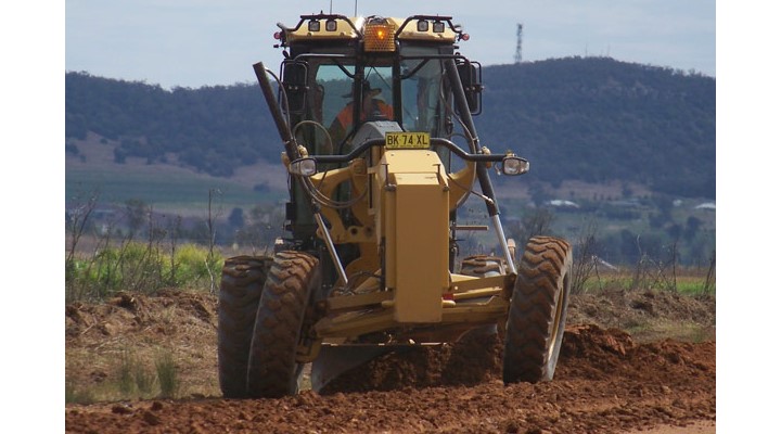 Apply PolyCom with your existing machinery - grader, roller and water cart.