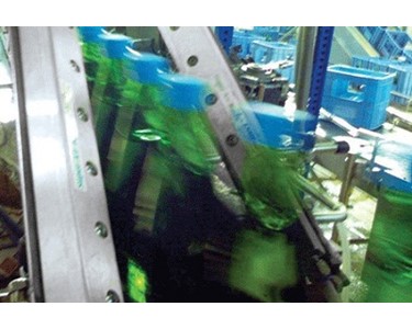 Fast moving bottles are blown dry by (2) 12" Super Air Knives prior to labelling.
