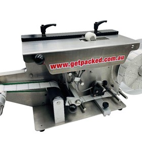 Compact Security Label Applicator for applying labels over corners