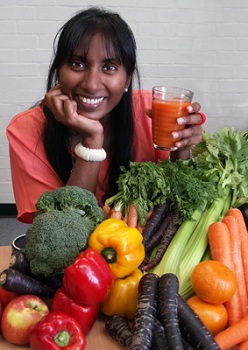 Dr Padayachee with orange carrot juice and other vegetables included in her research.