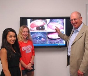 (from left) Fourth-year Master of Optometry students Antara Saha and Kate Weller with Professor Hugh Taylor.