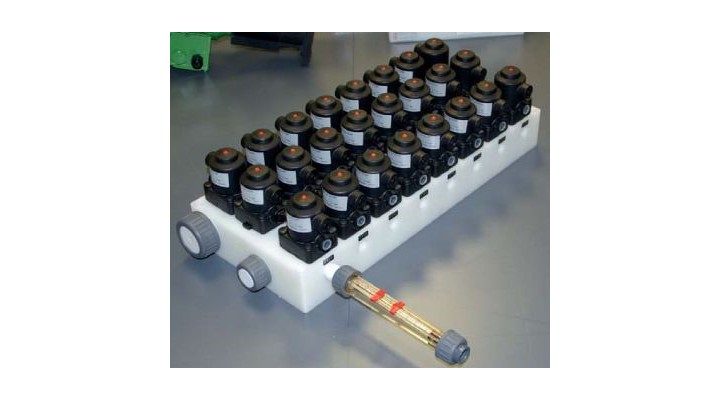 Multi-port valve block with flowmeter for detergent dosing and distribution