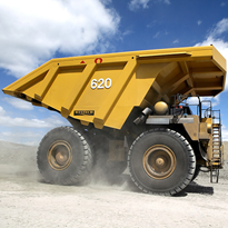 Improved dust control for off-highway dump trucks